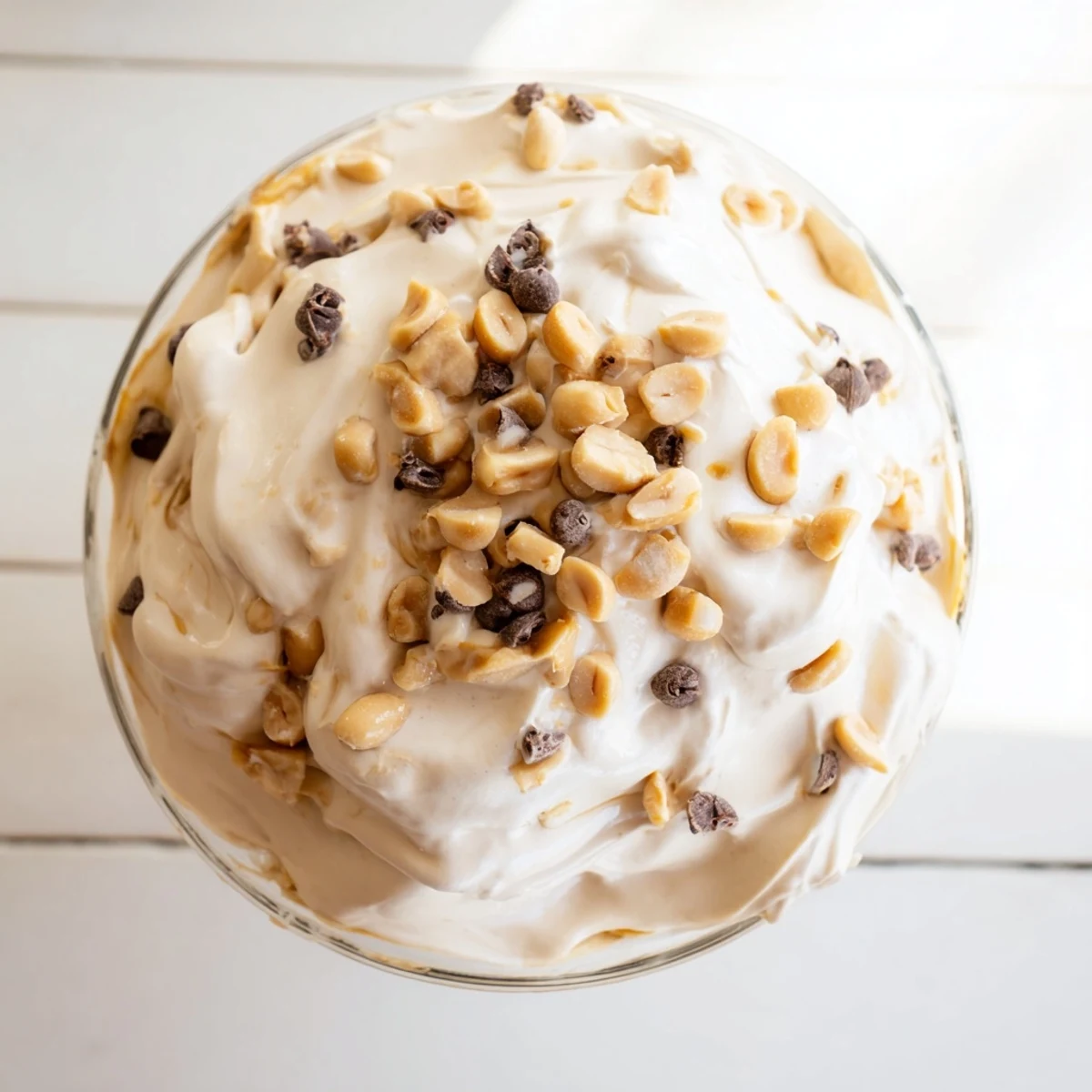 American peanut butter and Cool Whip mousse served chilled in clear glasses with mini chocolate chip sprinkles