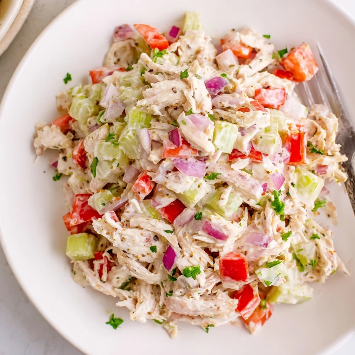 High Protein Pepperoncini Chicken Salad with tender shredded chicken, tangy brine.