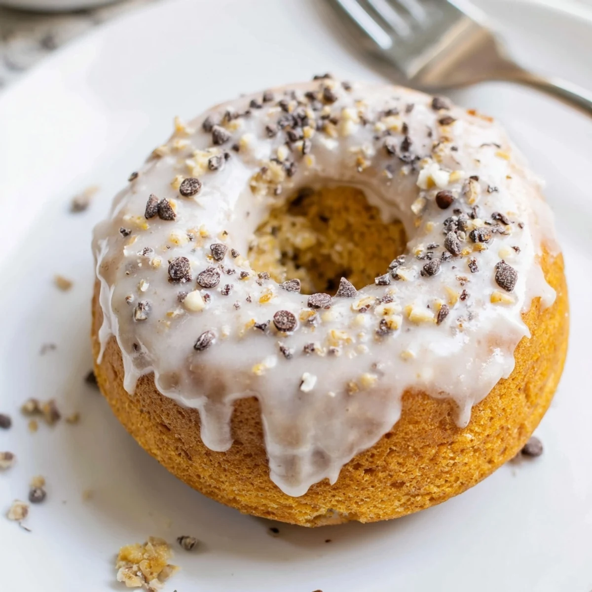 Warm Banana Donuts glazed and stacked on a wire rack, golden aroma