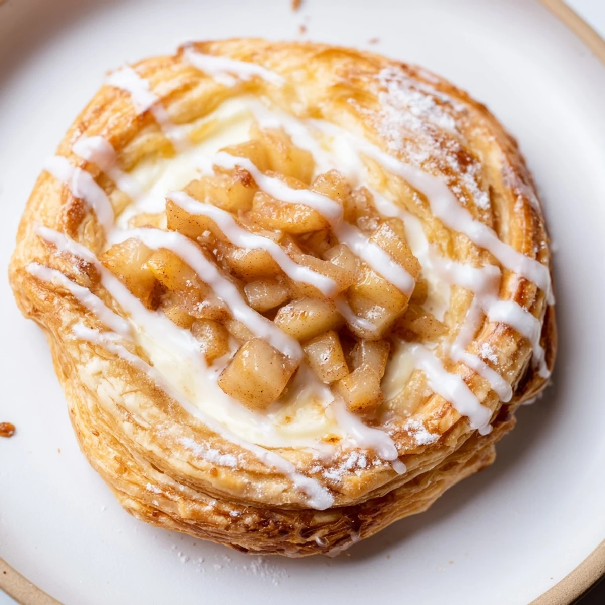 Flaky Apple Cheese Danishes topped with cinnamon spiced apples and creamy filling